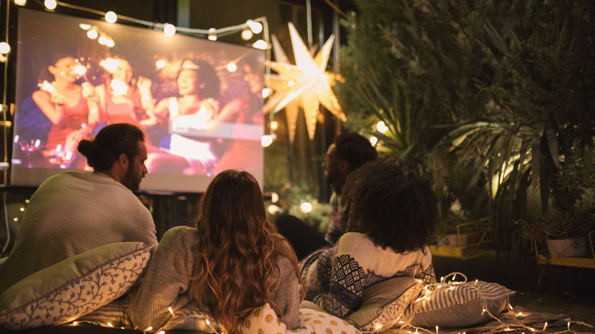 Families watching a movie under the stars at Movies in the Park in Deerfield Beach.