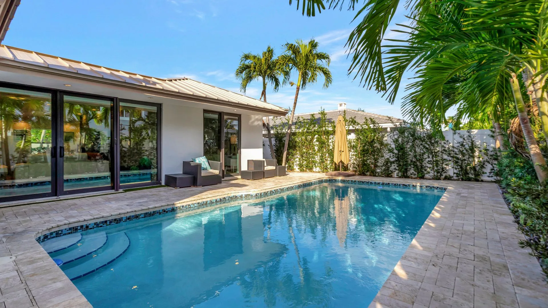 Fort Lauderdale vacation rentals with heated pool, smart-home tech, lakefront views, and modern luxury interiors in Coral Ridge.
