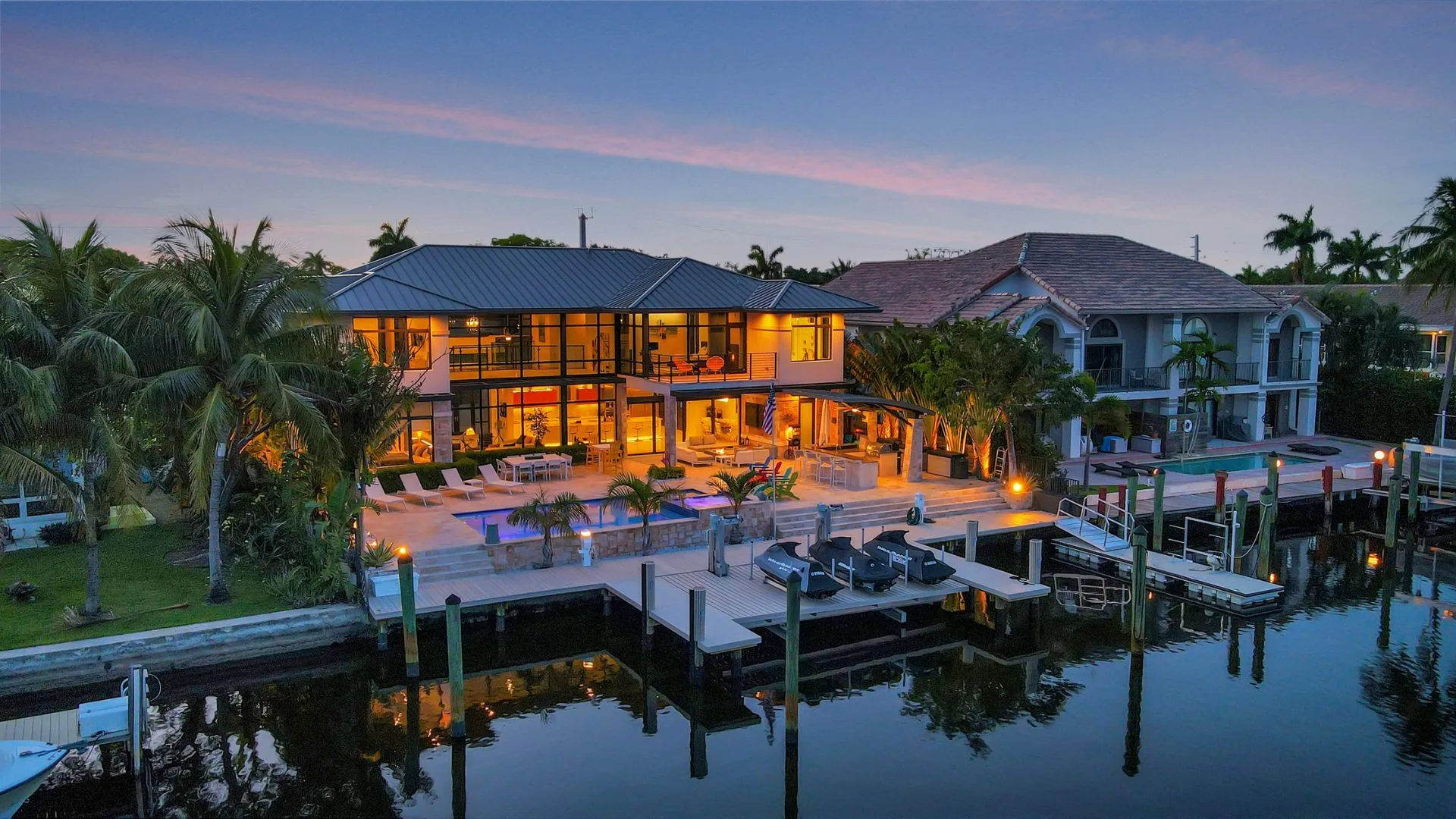 Luxury Fort Lauderdale vacation rental estate with heated pool, spa, private Intracoastal dock, and outdoor entertainment area in Bayview.